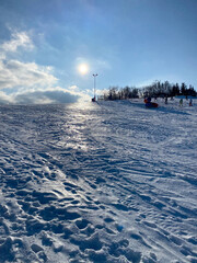 snowy ski slope landscape with mountains