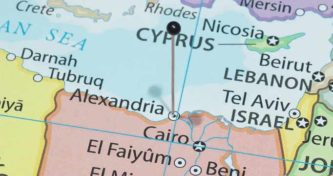 A zoom out of a black pin into Alexandria city of Egypt political map