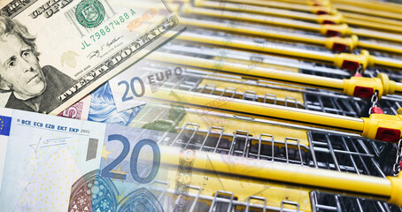 Shopping cart closeup with money. Dollar and euro banknotes on trolley. Consumer spending concept. Retail payment idea. Inflation and prices theme. Supermarket finance background. © Paweł Michałowski