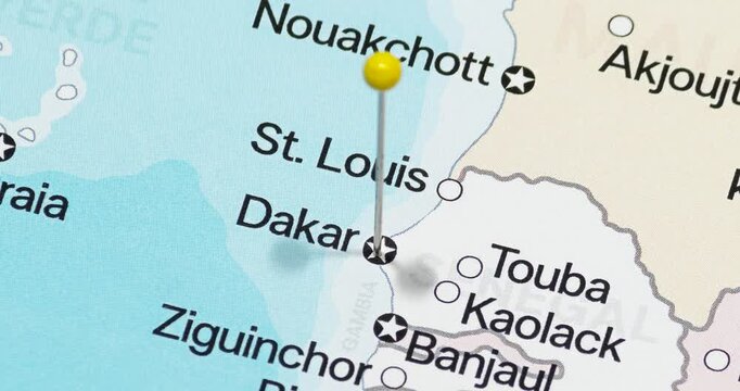 A zoom out of a yellow pin into dakar city of senegal political map