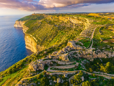 Drone view of cliffs and sea. Sunset, countryside, rocks, hills. Dingli cliffs. Mediterranean sea, Malta island