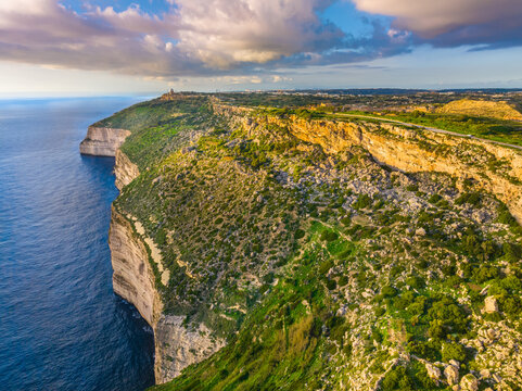 Drone view of cliffs and sea. Sunset, countryside, rocks, hills. Dingli cliffs. Mediterranean sea, Malta