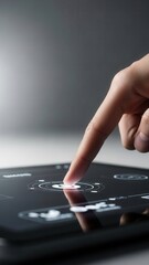 Index finger reaching to engage touchscreen in minimal studio setting