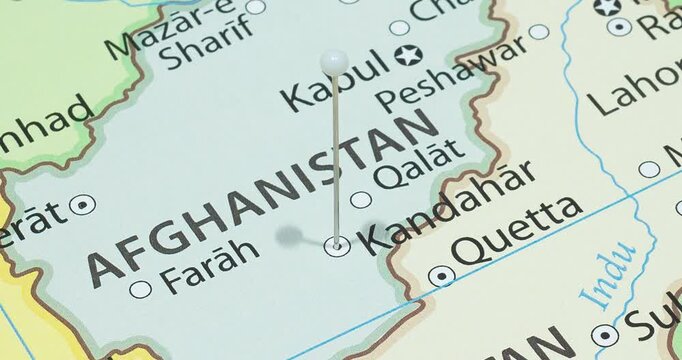 A zoom out of a white pin into kandahar city of afghanistan political map