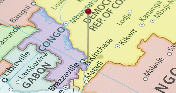 A zoom out of a red pin into kinshasa city of democratic republic of congo political map