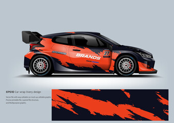 An energetic orange and black car wrap with bold racing patterns that emphasize speed and aggressive performance.