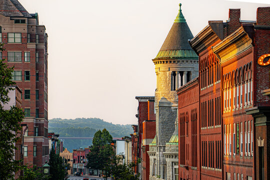 Looking down Water Street in Augusta, Maine with hills and forests in the distance