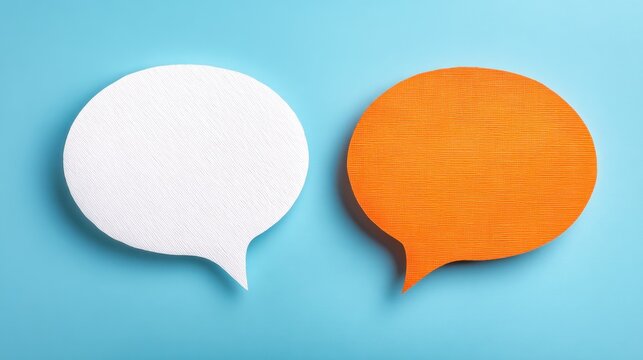 Two speech bubbles are placed on a blue background. One bubble is white and the other is orange. They represent ideas and concepts related to conversation and communication.