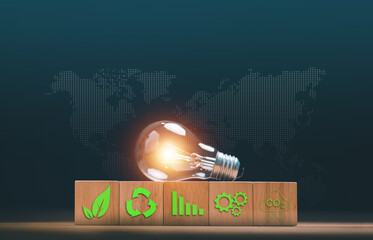 Sustainable business and green energy concept. Light bulb and wood blocks with eco icons. Renewable solution, recycling, carbon reduction, ESG, environmental technology and global sustainability.