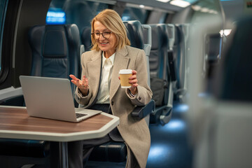 Woman making a video call on train traveling