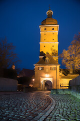 illuminated tower and doorway Segringer Tor, old town Dinkelsb&uuml;hl at night