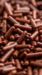 Close-up view of numerous dark brown chocolate sprinkles, perfect for dessert toppings and decorations.