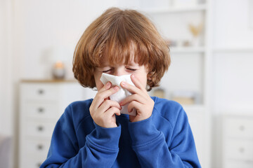 Little boy with runny nose at home. Cold symptom © New Africa