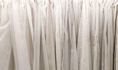 Obraz premium White sheer drapery showing fabric textures and delicate lace patterns for interior design backgrounds