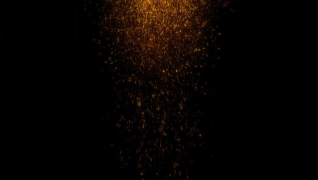 Fiery Sparks Falling Against Dark Background