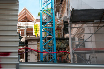 City Construction Site with Blue Crane and Scaffolding