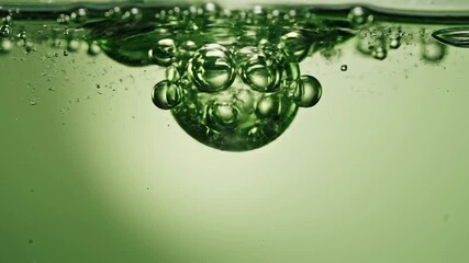 Vibrant green liquid filled with numerous effervescent bubbles rising dynamically from the depths creating a mesmerizing and refreshing abstract background texture showcasing the intricate dance of g. - Powered by Adobe