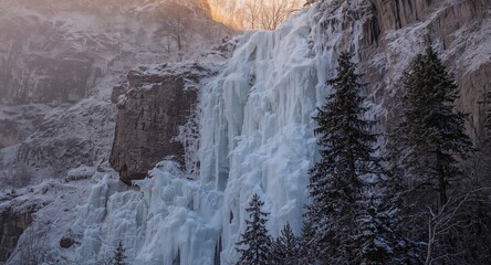 Frozen Cascade. A Winter Landscape of Ice Formations and Cliffside Vegetation.