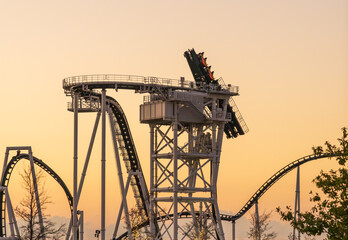 Latest design of roller coaster with the cars rotating vertically awaiting their release into the track for the thrilling ride