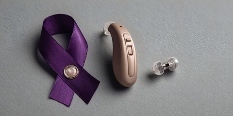 Purple awareness ribbon with hearing aid device for support and inclusion