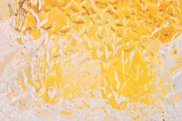 Obraz premium Abstract glass yellow and white paint pouring texture background