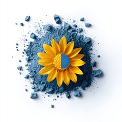 Stylized flower atop blue pigment powder, half blue, centered on white