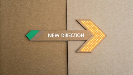 Arrow indicating new direction on textured cardboard background