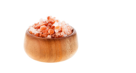 Exotic ingredient for cooking - Himalayan salt crystals in a wooden bowl on a white background