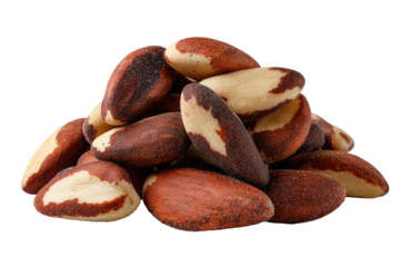 Pile of brown and white Brazil nuts on black background