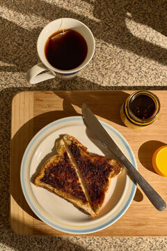 Toast with yeast extract spread with cup of tea.