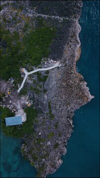 Aerial Drone View Path Leading To Balines temple, Stone Walkway Branches Into,Nusa Dua, Bali,Indonesia,Vertical video