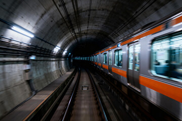 Obraz premium Subway Train in Motion Through Urban Tunnel