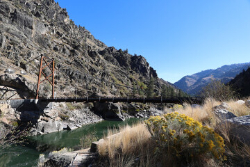 Photo of the vintage Manning Bridge over the Salmon River upstream from Riggins Id  this historical cable suspension bridge has been replaced