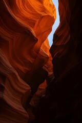 Sunlit Sandstone Walls in Slot Canyon with Blue Sky &ndash; Nature Photography of Antelope Canyon
