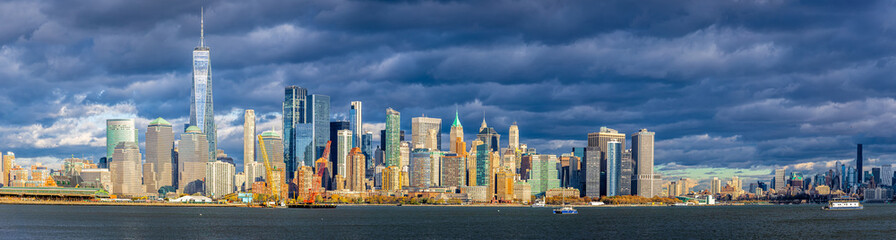 Lower Manhattan skyline across New York Harbor with Freedom Tower, NYC