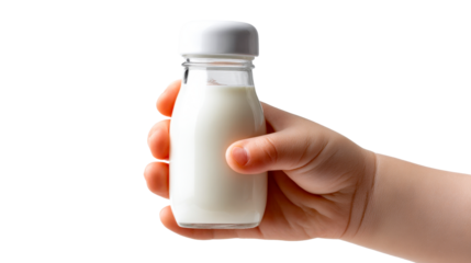 Close up of a childs hand gently holding a small glass bottle filled with fresh white milk, perfect for nutritional content, healthy lifestyle promotions, and childhood wellness campaigns.