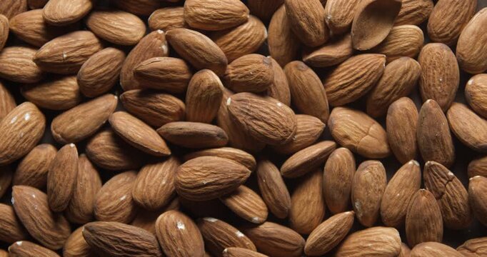 Almonds close up studio shot over rotating