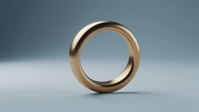 closeup of a minimalist golden ring with cold soft light