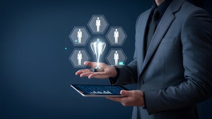 Businessman presenting digital trophy and team icons on tablet
