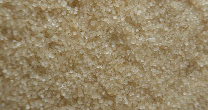 Cane sugar close up studio shot over rotating