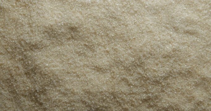 Cane sugar close up studio shot over rotating