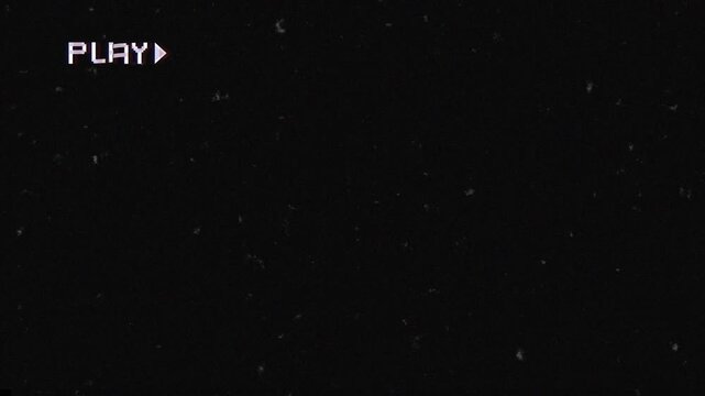 An old damaged VHS tape playing. VHS defects, artifacts and noise.  over noise and glitch from an analog TV, with a PLAY text.