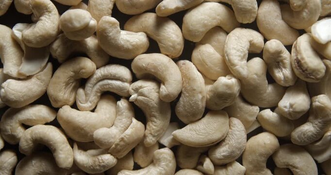 Cashew nuts close up studio shot over rotating