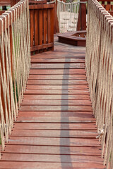Wood walkway in playhouse with sunshine on background