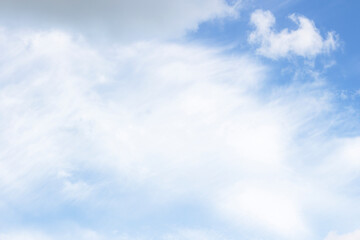 Obraz premium A beautiful clear blue sky features bright white fluffy cumulus clouds on a natural summer day creating a stunning high atmosphere cloudscape