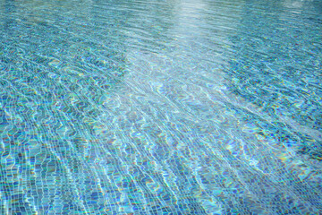 Naklejka premium Swimming pool with blue crystal clear water surface and ripple wave background