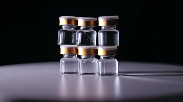 Precise macro shot of transparent vials symbolizing science and innovation