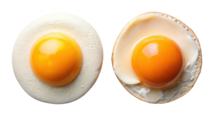 Two fresh halved hard boiled eggs on black background