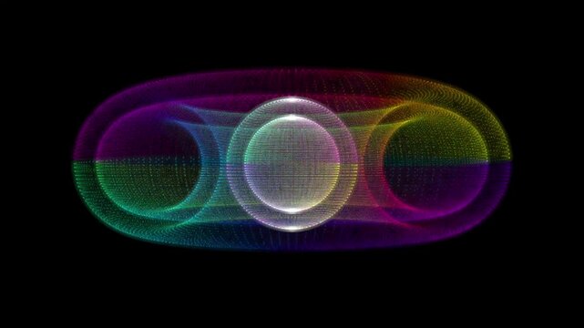 A complex, 3D toroidal structure made of fine glowing particles. The shape shifts and zooms toward the viewer, revealing a multi-layered sphere within a ring, glowing with a full rainbow spectrum.