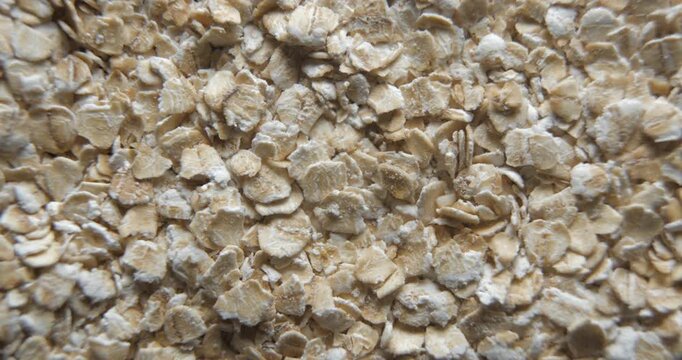 Oat flakes close up studio shot over rotating